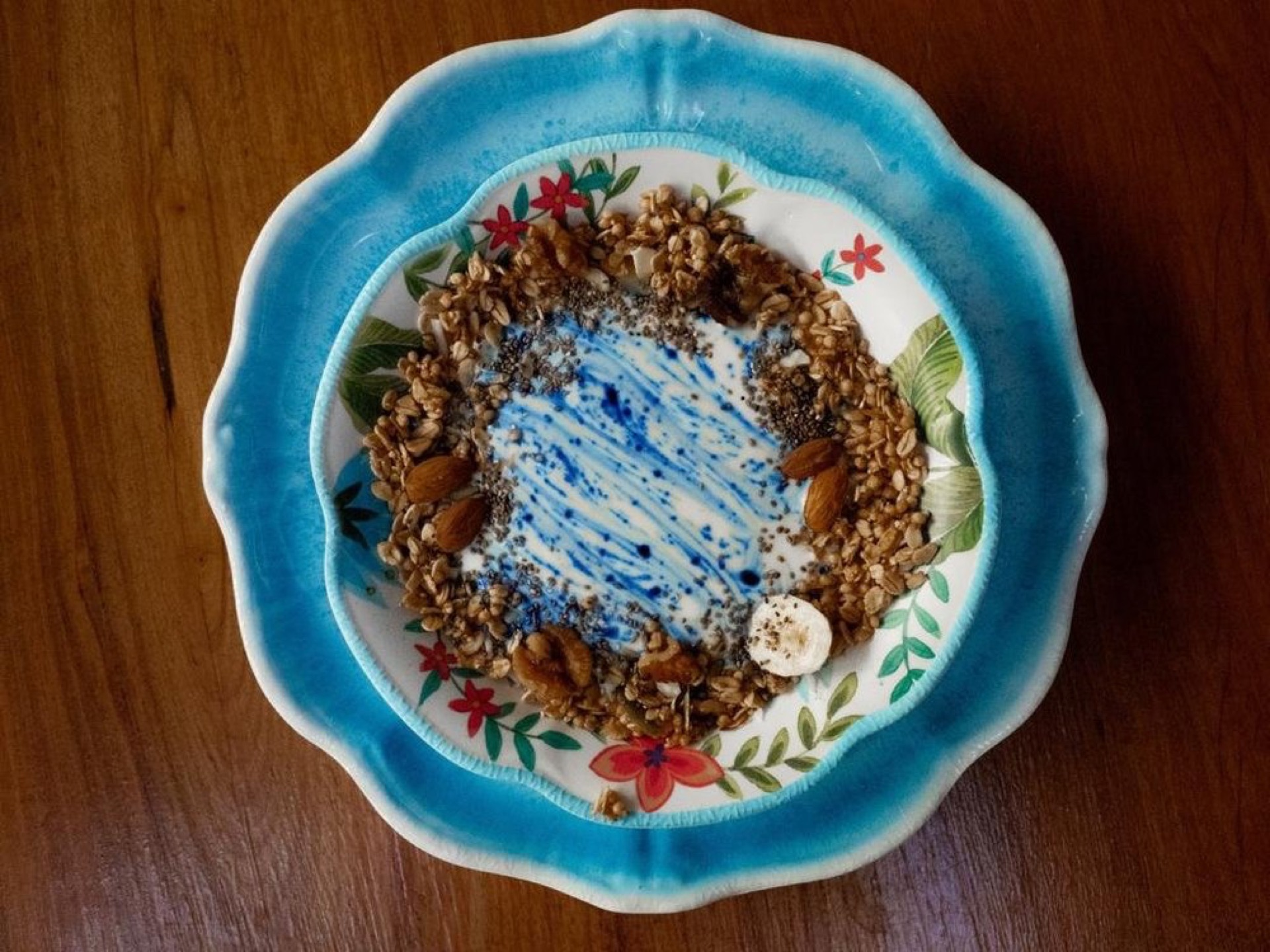 Granola bowl with butterfly pea flower